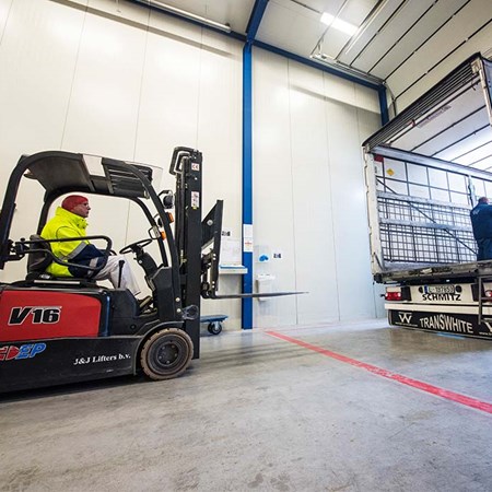 Employee loading truck with fork lift